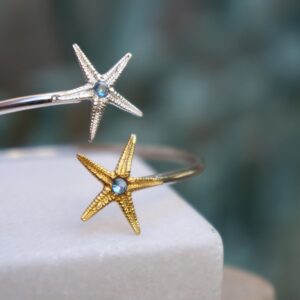 Silver Starfish Bracelet: Adjustable Cuff with Blue Zircon